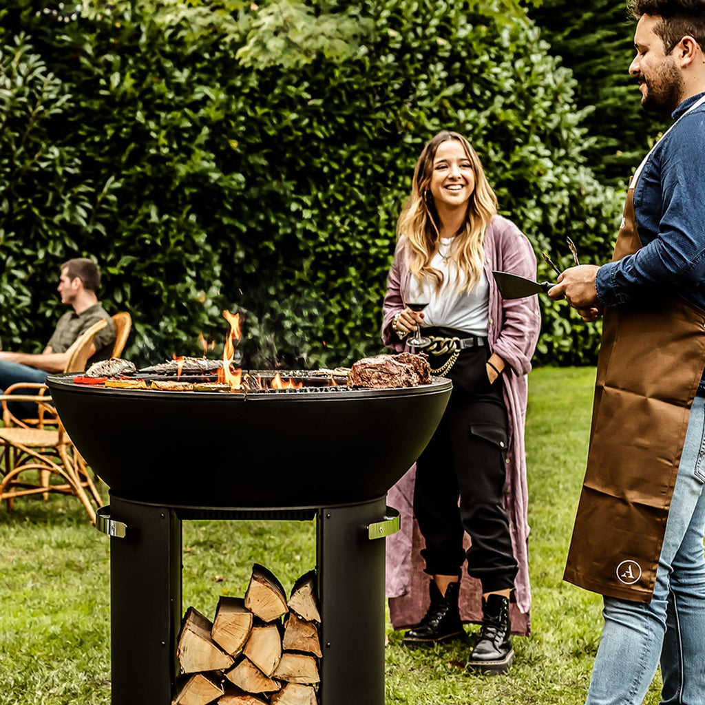 Zenith 38” Cast Iron Fire Pit with Standing Base, Grill Grate, Griddle, and Soapstone Surfaces